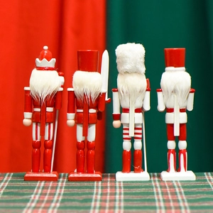 Back view of four traditional 18cm wooden nutcracker soldiers in classic festive colors