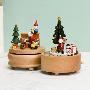 Exquisite wooden Christmas music box with Santa and rotating train on a beech wood base