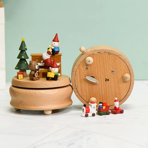 Handcrafted wooden Christmas music box with Santa Claus and revolving holiday figurines