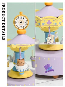Macro details of hand-painted wooden carousel music box with Alice in Wonderland theme
