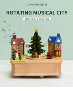 Detailed craftsmanship of rotating wooden Christmas tree music box with street scene