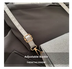 Detail of silver sequin bag with adjustable gold buckle and lobster clasp strap