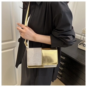 Close-up of a glamorous gold and silver glitter patchwork crossbody bag for women