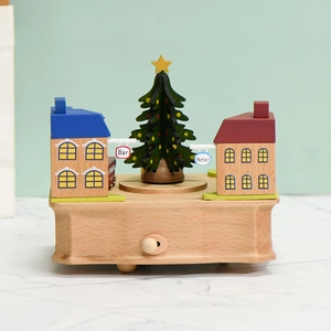 Handcrafted wooden Christmas tree music box with rotating base and festive village scene