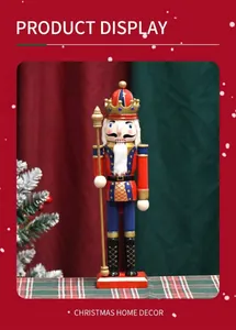 Close-up of a 30cm wooden nutcracker soldier with a golden crown and scepter decor