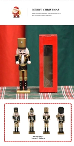 Detail view of 18cm black and gold nutcracker soldier with glitter and packaging box