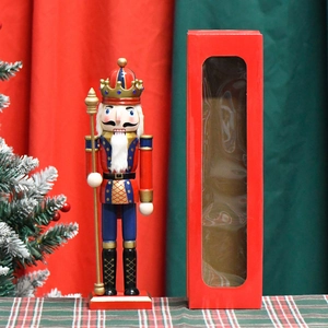 Classic 30cm wooden nutcracker soldier figure in festive gift box with Christmas tree backdrop
