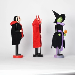 Set of three Halloween wooden nutcrackers featuring vampire demon and witch figures