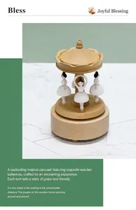 Detail of wooden carousel music box with dancing ballerina figures and natural wood grain