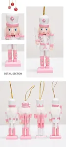 Detailed view of pink and white wooden nutcracker soldiers with silver rhinestones