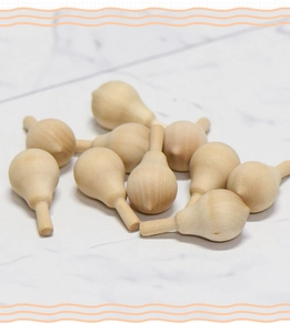 Macro detail of unfinished smooth wooden gourd pendants for creative DIY crafts and art projects