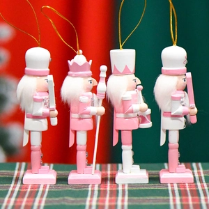 Set of 4 pink and white wooden nutcracker Christmas ornaments with glitter details