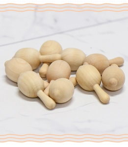 Macro view of unpainted natural wood mini shakers for DIY crafts and early education