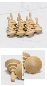Macro detail of natural wooden spinning top showing multi-layered texture and smooth finish