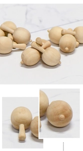 Close-up of unfinished wooden mushroom pendants for DIY crafts with natural wood grain texture