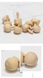Close-up of polished natural wood mushroom crafts showing smooth texture and wood grain