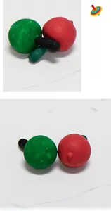 Close-up of red, green, and black DIY gyro components for creative kids art painting
