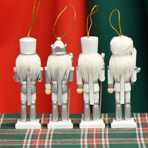 Back view of four white and silver 13cm wooden nutcracker soldier Christmas ornaments