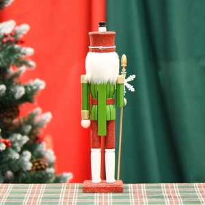 Vue arrière du soldat casse-noisette de 38cm avec uniforme vert et sceptre flocon doré