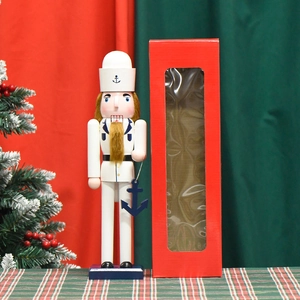 Navy sailor nutcracker with blue anchor and red gift box for Christmas home decoration