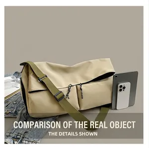 Detail of spacious beige gym bag with green straps showing tablet storage capacity