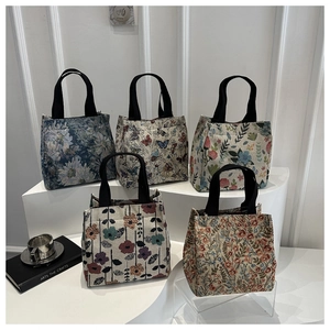 Detailed view of 5-piece floral jacquard tote bags set with reinforced handles