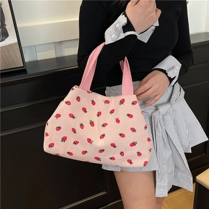 Pink corduroy tote bag with red strawberry print featuring fabric handles for summer