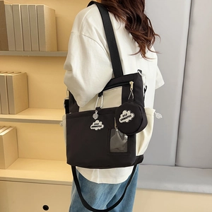 Large black and white canvas tote bag with adjustable strap and round coin purse