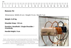 Detail view of stylish PU leather bag with gold buckle and Fashion brand tag on hanger