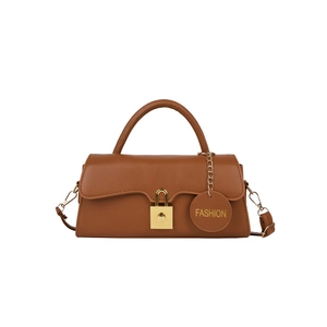 Brown retro leather shoulder bag with wavy flap design and gold square lock closure