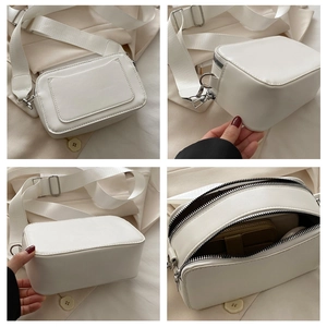 White rectangular crossbody bag with wide canvas strap and dual zippers shown in multiple views