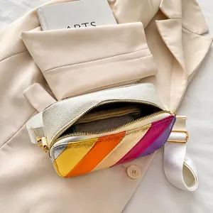 Internal storage detail of striped crossbody camera bag with gold zipper and wide strap