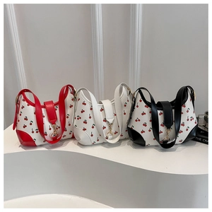 Three half-moon cherry print shoulder bags with red white and black contrast leather trim