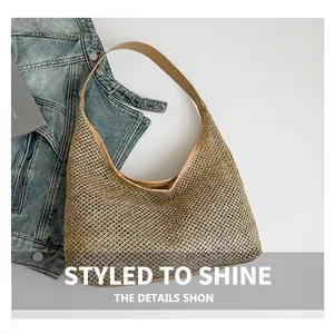 Detail of metallic beige woven mesh hobo bag with smooth leather shoulder strap and textures