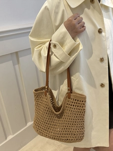 Chic woven beach tote with brown leather straps and diamond hollow knit texture