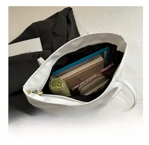 White faux leather tote bag with crocodile pattern showing large capacity for tablet and umbrella