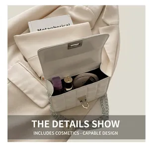 Interior storage space of white quilted chain bag showing cosmetics and daily essentials