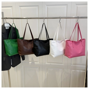 Five assorted vintage tote bags with crocodile pattern texture in various colors