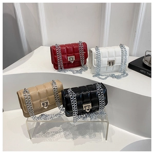 Quilted mini crossbody bags in red, white, beige and black with silver chain straps
