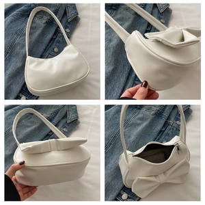 Detail views of a white crescent shoulder bag featuring a large decorative bow