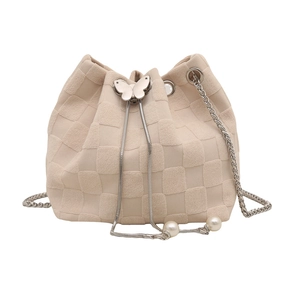 Cream knit bucket bag with checkerboard pattern, butterfly clasp, and pearl details
