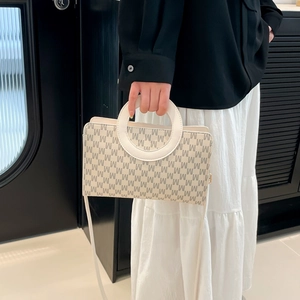 Chic beige crossbody bag with grey M-letter print and white circular handles