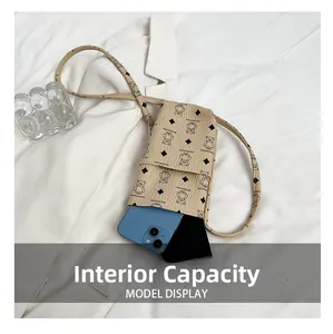 Internal capacity of beige printed crossbody phone bag with phone and power bank