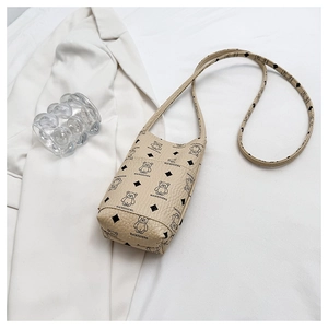 Close-up of litchi grain phone bag with cute bear print on a soft white background