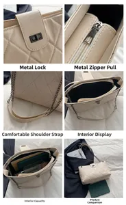 Detail view of large quilted tote bag featuring metallic chain strap and turn-lock closure