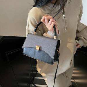Minimalist grey woven patchwork square handbag with gold buckle and black shoulder strap