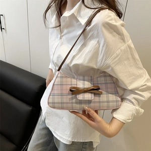 Chic plaid underarm bag with pink and blue check pattern and brown leather bow detail