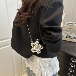 Silver flower-shaped acrylic crossbody bag with pearl center and metal chain strap
