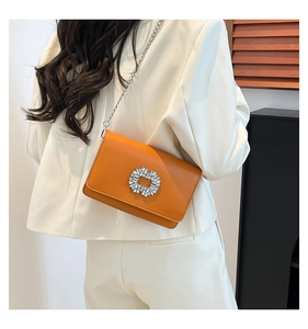 Fashionable orange leather square bag with diamond buckle and silver chain strap