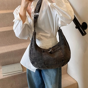 Retro charcoal washed denim hobo bag featuring a knotted shoulder strap and front pocket